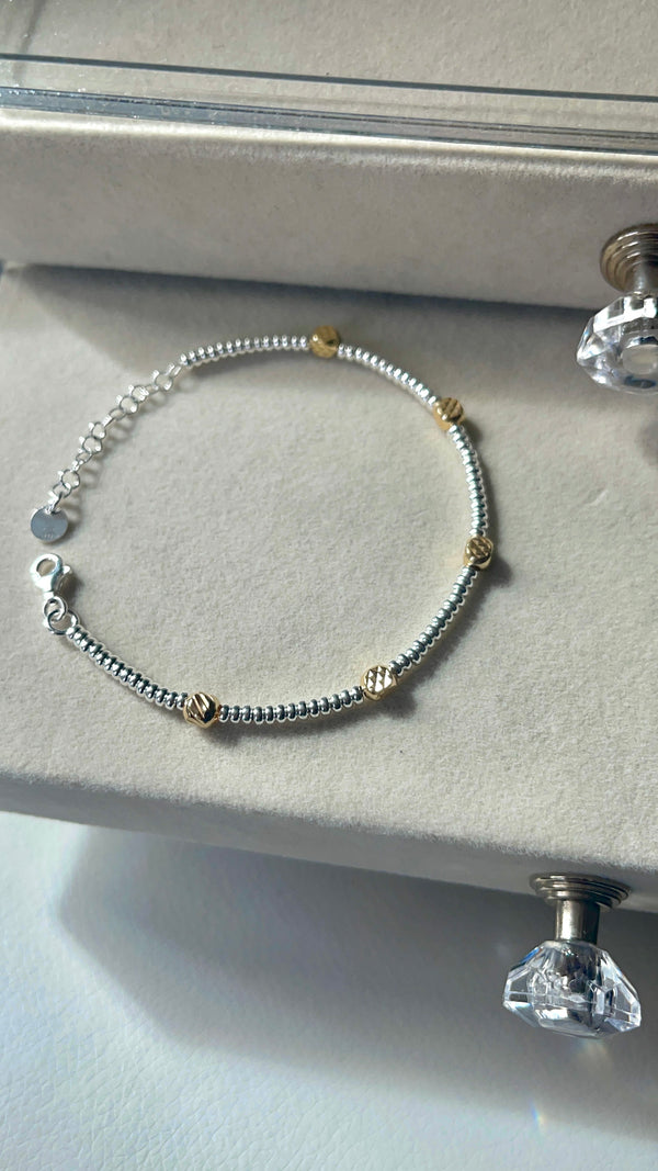 Bracciale rondelline e cubetti diamantati